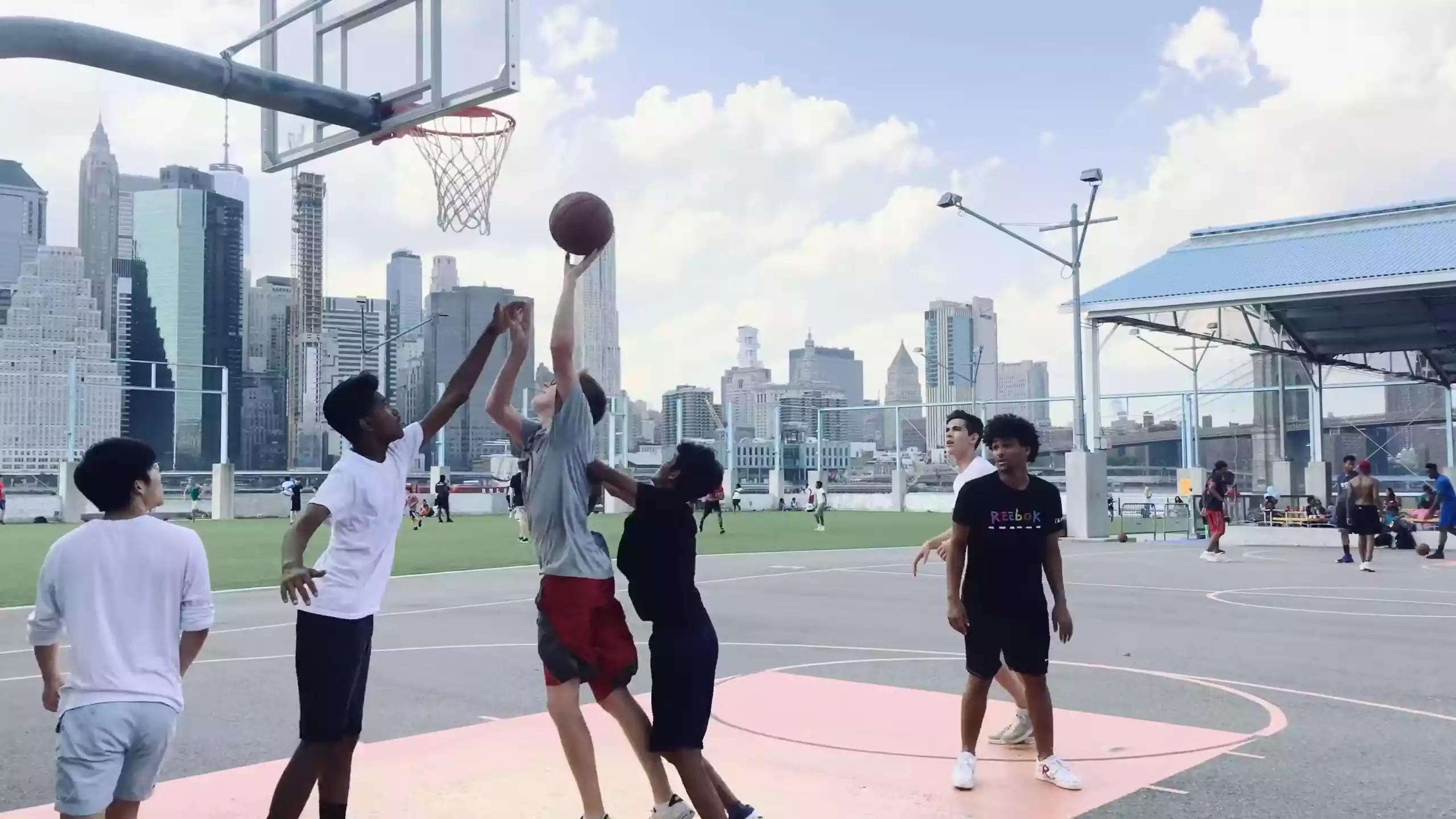 A players trying to goal in basketball match.