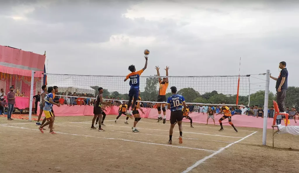 two adults team playing volleyball match. 