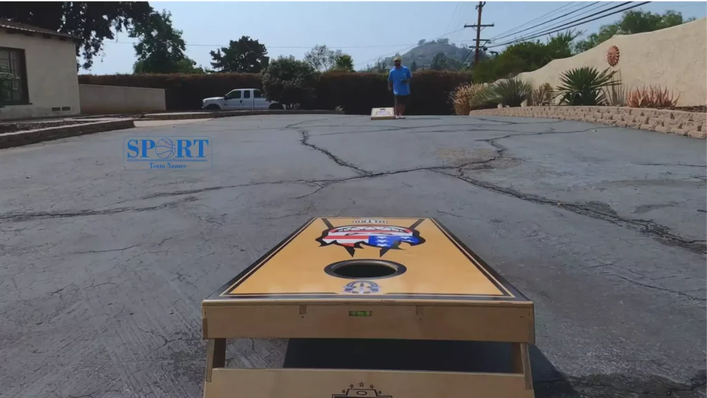 A man playing cornhole.